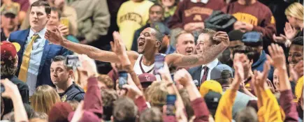  ?? HARRISON BARDEN/USA TODAY SPORTS ?? Minnesota guard Dupree McBrayer, center, acknowledg­es the crowd following a game against Purdue on Tuesday at Williams Arena.