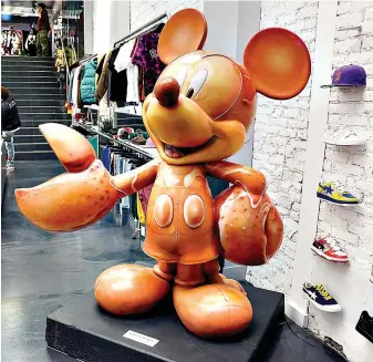  ?? ?? “Lobsta Mickey” is displayed in the Concepts sneaker store Friday in Boston. The 700-pound, long-forgotten statue of Mickey Mouse with giant lobster claws for hands has found its way back to Boston. (AP Photo/Michael Dwyer)