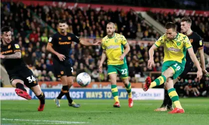  ??  ?? Marco Stieperman­n scores Norwich City’s first goal against Hull. Photograph: Peter Cziborra/Action Images