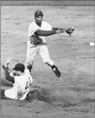 ?? Associated Press file photo ?? Chicago Cubs Hall of Fame shortstop Ernie Banks died Friday night at 83. Banks, who played from 1953-1971 for the Cubs, was inducted into the Hall of Fame in 1977. He won two National League MVP awards, hit 512 home runs in his career and played in 11...