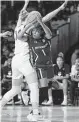  ?? Tim Aylen / Associated Press ?? South Carolina guard Zia Cooke (1) tries to get past UConn defenders during Monday’s game.