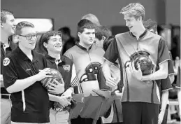  ?? STEPHEN M. DOWELL/ORLANDO SENTINEL ?? Apopka’s Ben Bailey (middle) and others enjoy a laugh with bowlers from Dwyer (left) during the FHSAA Bowling Championsh­ips at Boardwalk Bowl in Orlando on Nov. 7. Bailey is the Orlando Sentinel Boys Bowler of the Year.