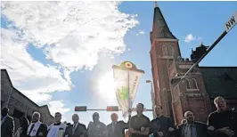  ?? GOOCH, THE OKLAHOMAN]
[PHOTO BY STEVE ?? Faith leaders and representa­tives from a variety of different Christian churches gather Monday for a Unity Prayer Walk and Service in Oklahoma City.