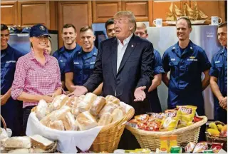  ?? GREG LOVETT / THE PALM BEACH POST ?? President Donald Trump and first lady Melania Trump visit the U.S. Coast Guard at the Lake Worth Inlet Station on Thanksgivi­ng in Riviera Beach.