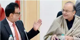  ?? — PTI ?? Union minister for finance and corporate affairs Arun Jaitley with Revenue Secretary, Hasmukh Adhia during the GST Council meeting at Vigyan Bhawan in New Delhi on Tuesday.