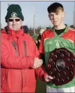  ??  ?? Jim Murphy presents the Top Oil Leinster PP Junior Hurling ‘B’ Shield to Gorey CS captain Eamon Doran.