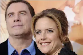  ?? AP fiLe ?? ‘VERY HEAVY HEART’: Kelly Preston and her husband, John Travolta, are seen at the 2010 premiere of ‘The Last Song.’ Preston, 57, died Sunday after a two-year battle with breast cancer.