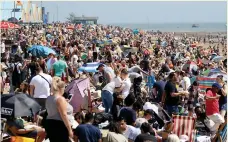  ??  ?? CROWDED SANDS: Sunseekers take to Southend beach