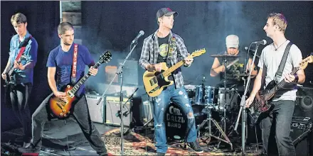  ?? SUBMITTED PHOTO ?? Loyal Thieves made up of Cody Cudmore, left, Ian Murray, Darcy Cudmore, JD Geldert and Daniel Cudmore. The band’s song “Nowhere Fast” will be in the new NASCAR video game, titled NASCAR Heat 3. The game is set to be released on Sept. 7.