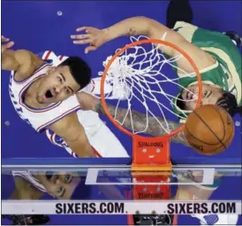  ?? MATT SLOCUM — THE ASSOCIATED PRESS ?? The 76ers’ Timothe Luwawu-Cabarrot, left, tries to shoot past the Celtics’ Gerald Green during the second half Sunday.