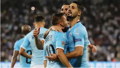  ?? (Ammar Awad/Reuters) ?? ISRAEL CELEBRATES their second goal on Sunday night.