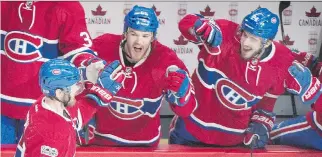  ?? GRAHAM HUGHES/THE CANADIAN PRESS ?? Montreal Canadiens’ Paul Byron, left, celebrates with teammates Andrew Shaw and Phillip Danault after scoring against the Ottawa Senators during third-period action on Sunday.