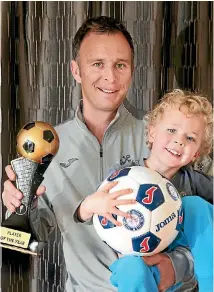  ?? PHOTO: DEREK FLYNN ?? Aaron Hayes, Marlboroug­h footballer of the year, enjoys the spoils of success with his four year-old son Ryan.