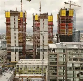  ?? AL SEIB, LOS ANGELES TIMES ?? Oceanwide Plaza, a developmen­t across from Los Angeles’ Staples Center, is being built with concrete that includes sand and gravel imported from Vancouver Island.