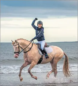  ?? ?? Horse riding along the beach at St Andrews