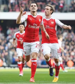  ??  ?? Xhaka (left) celebrates with Nacho Monreal after his deflected shot from long range gave Arsenal the second-half lead