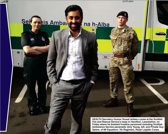  ?? ?? HEALTH Secretary Humza Yousaf strikes a pose at the Scottish Fire and Rescue Service’s base in Hamilton, Lanarkshir­e, on Friday where he thanked frontline personnel including Scottish Ambulance Service paramedic Amy Young, left, and Private Guy Spiers, of 68 Squadron, 7th Regiment, Royal Logistic Corps.