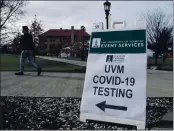  ?? LISA RATHKE — THE ASSOCIATED PRESS FILE ?? A University of Vermont student walks toward a tent leading to a COVID-testing site on campus in Burlington, Vt.