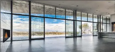  ??  ?? The Cloud Chaser, an Inspiratio­nal Home in Ascaya, has lots of windows to let in the views.