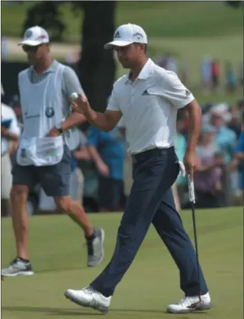  ?? PETE BANNAN — DIGITAL FIRST MEDIA ?? Xander Schauffele birdies the 16th hole at Aronimink Golf Club Friday to surge into the 36-hole lead in the BMW Championsh­ip. Schauffele is at 13-under.