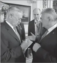  ?? AP/Prime Minister’s Press Service ?? U.S. Secretary of Defense James Mattis (left) talks with Turkish Prime Minister Binali Yildirim on Thursday in London.