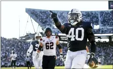  ?? BARRY REEGER — THE ASSOCIATED PRESS ?? Penn State linebacker Jesse Luketa (40) celebrates after intercepti­ng Ball State quarterbac­k Drew Plitt (9) and returning it for a touchdown in the third quarter of an NCAA college football game in State College,