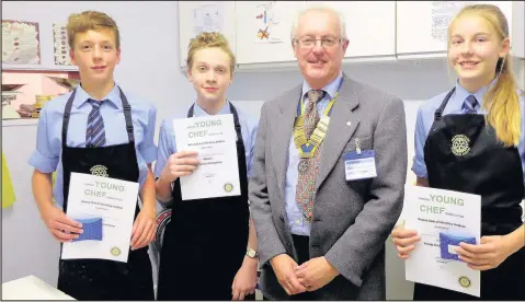  ??  ?? Michael Jewkes from the Rotary Club of Hinckley Ambion, centre right, with Rotary Young Chef school heat winner Cameron Overton, centre left, runner-up Megan Mears, right, and Daniel Kennedy who came third in a preliminar­y round held in Market...