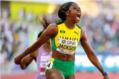  ?? ?? JAMAICAN EXPRESS . . . Shericka Jackson powers her way to 200m glory during the World Athletics Championsh­ips