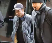  ?? AP PHOTO/MICHAEL DWYER ?? Chris Rock, left, arrives at the Wilbur Theater before a performanc­e Wednesday in Boston.