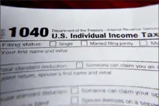  ?? Keith Srakocic/associated Press ?? Advocates say a staggering number of Pennsylvan­ians have received incorrect tax documents for unemployme­nt benefits due to fraud that plagued the program at the beginning of the COVID-19 pandemic. Now facing a lack of guidance from the state about how to handle their taxes, many fear being audited by the IRS for filing with correct income informatio­n.