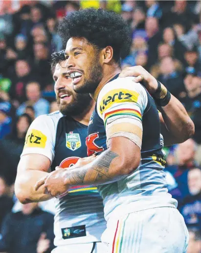  ?? SCORED: Penrith’s Waqa Blake and Josh Mansour celebrate a try against the Storm last night. ??