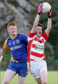  ??  ?? Jordan Donovan (St. Mary’s, Maudlintow­n) makes a fine catch under pressure from Matthew McQuillan (Gusserane).