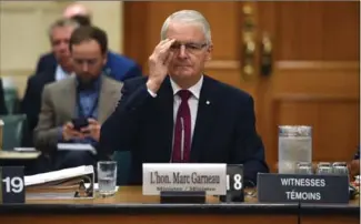  ?? SEAN KILPATRICK, THE CANADIAN PRESS ?? Minister of Transport Marc Garneau appears as a witness at a committee on Parliament Hill on Thursday.