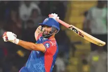  ?? AFP ?? Delhi Capitals’ captain Rishabh Pant celebrates his half century during an IPL match against Gujarat Titans at the Arun Jaitley Stadium in New Delhi yesterday.