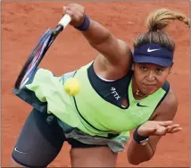  ?? CHRISTOPHE ENA — THE ASSOCIATED PRESS ?? Japan’s Naomi Osaka serves against Amanda Anisimova of the U.S. during their first round match at the French Open in Roland Garros stadium in Paris, France on Monday.