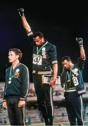  ?? Associated Press file ?? U.S. sprinters Tommie Smith, center, and John Carlos protested racial injustice at the 1968 Games.