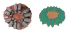  ??  ?? The open arrangemen­t of a fossil oviraptor nest (left) and a reconstruc­ted oviraptor nest (right) with blue-green eggs. Note that the original inclinatio­n of the eggs would have been steeper due to sediment compaction. Composite: J. Wiemann et al., 2017