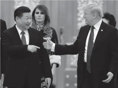  ?? Associated Press ?? ■ President Donald Trump and China’s President Xi Jinping arrive Nov. 19, 2017, for a state dinner with the first ladies at the Great Hall of the People in Beijing.