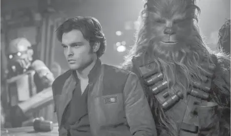  ??  ?? Alden Ehrenreich as Han Solo, with Chewbacca, played by Joonas Suotamo, in Solo: A Star Wars Story.
