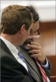  ?? GERRY BROOME — THE ASSOCIATED PRESS ?? Patrick Jones, left, and his attorney Sam Coleman speak in a courtroom at the Orange County Courthouse in Hillsborou­gh, N.C., Monday. The Georgia man charged with violating North Carolina’s sports agent law has agreed to testify against a former NFL...