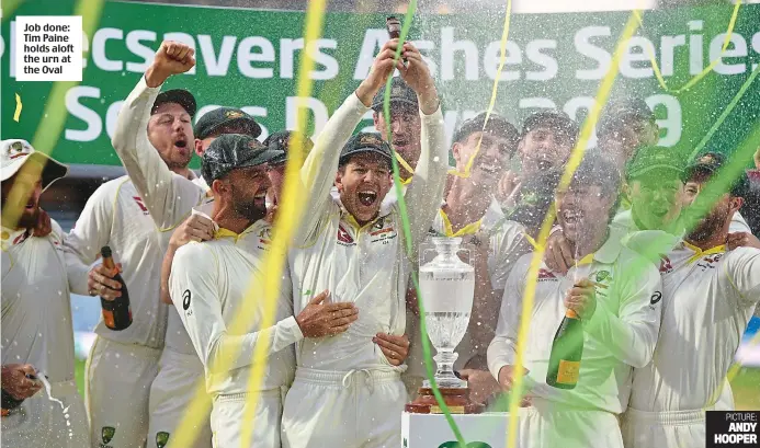  ?? PICTURE: ANDY HOOPER ?? Job done: Tim Paine holds aloft the urn at the Oval
