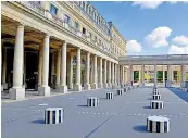  ??  ?? The courtyard at Palais Royal, left, is home to a striking Daniel Buren installati­on