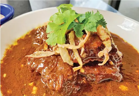  ??  ?? INTENSE. Delicious braised beef – Mindanao Style Beef stew with burnt coconut from Rekado