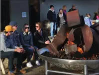  ??  ?? A fire pit at Crux Fermentati­on Project in Bend warms the toes, as an eclectic mix of stouts, IPAS and more warms beer lovers’ innards.