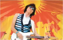  ?? GERALD HERBERT/AP 2011 ?? Jeff Beck performs at the New Orleans Jazz & Heritage Festival. Beck, 78, died Tuesday.