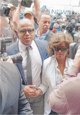  ?? | JOE KLAMAR~AFP/GETTY IMAGES ?? Michael Jackson’s brother Randy and sister Rebbie enter the court where their family’s suit against AEG Live is being heard.