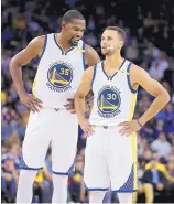  ?? BEN MARGOT/ASSOCIATED PRESS FILE ?? NBA standouts Kevin Durant, left, and Stephen Curry have had little trouble working together since the Warriors acquired Durant in the offseason.