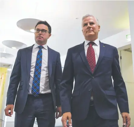  ?? Picture: AAP/Lukas Coch ?? WIN: David Littleprou­d (left) and Michael McCormack after the National Party leadership vote.