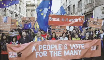  ?? AP PHOTO ?? BUILDING PRESSURE: Members of the public march in support of the People’s Vote campaign in Liverpool, during the Labour Party’s annual conference at the Arena and Convention Centre yesterday.