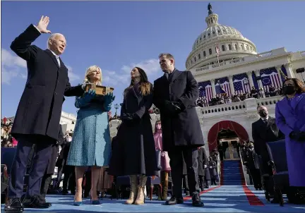  ?? THE ASSOCIATED PRESS ?? Joe Biden is sworn in as the 46th president of the United States on Wednesday at the Capitol by Chief Justice John Roberts as Jill Biden holds the Bible. Biden has big plans as he faces big problems. Berks County and state pundits, pollsters, politician­s and party leaders have different assessment­s about how Biden should go about managing the country.